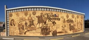 a mural painted in browns with the theme of Texas Rangers